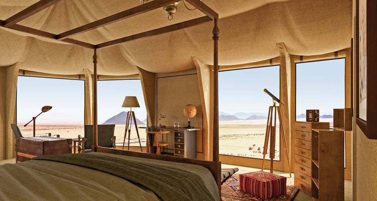 Luxury tented camp with panoramic desert views.