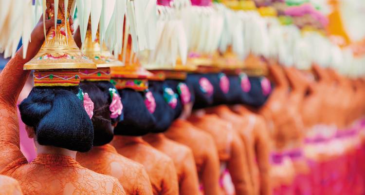 Colorful cultural procession with ornate headdresses