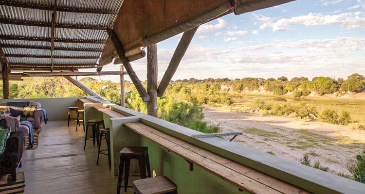 Open-sided lodge with a view of nature.