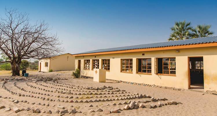 School building in a sandy area.