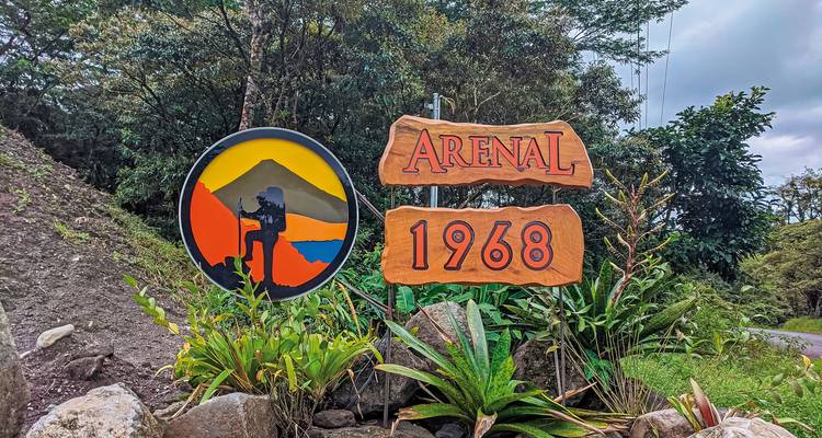 Entrance sign for Arenal 1968 with colorful design.