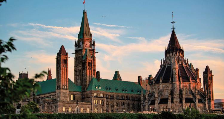 Close-up of historical parliamentary building during sunset.