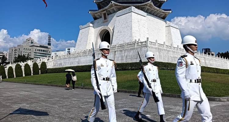 Changing of the guard in front of a historical building.