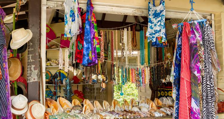 Colorful shop selling clothes, jewelry, and seashells.