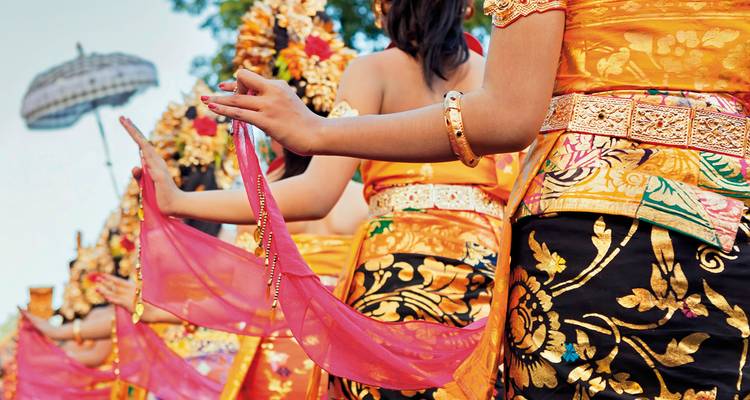 Traditional dancers in colorful costumes during a cultural performance.