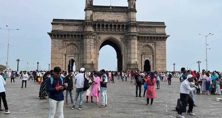 Visitors near Gateway of India, a famous monument in Mumbai.