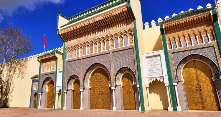 Grand palace entrance with ornate designs