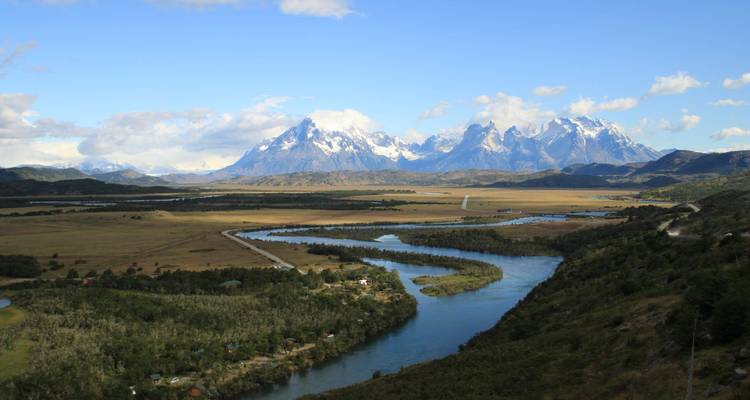 River winding through a valley with mountain views.