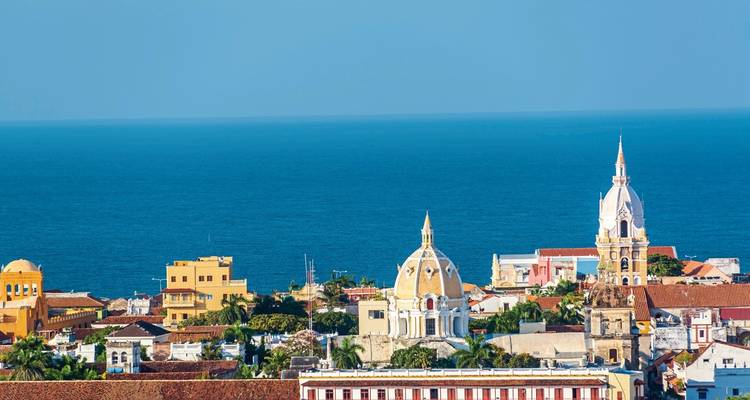 Panoramic view of a coastal city with domed structures.