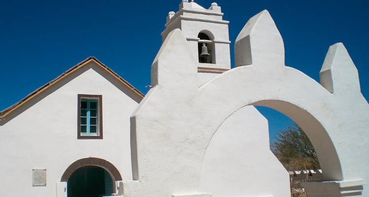 White church against a clear blue sky.