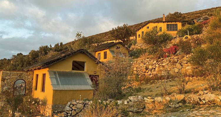 Hillside houses in a rural landscape.