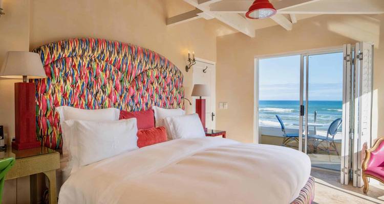 Luxurious bedroom interior with an ocean view.