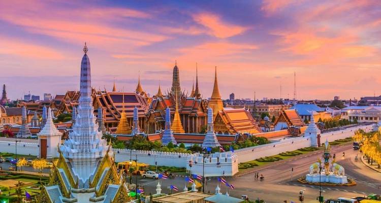 Scenic view of the Grand Palace complex at sunset.