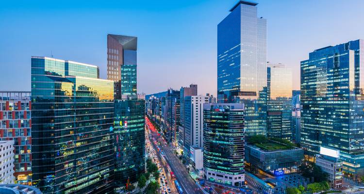 Urban skyline with modern skyscrapers during twilight.