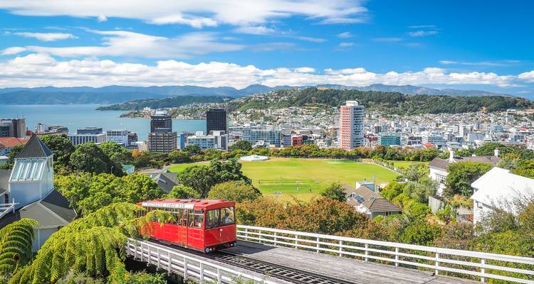 Cityscape of Wellington, New Zealand with a red cable car.