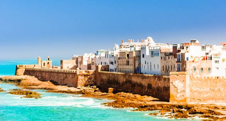 Coastal view of Essaouira with historic walls and buildings.