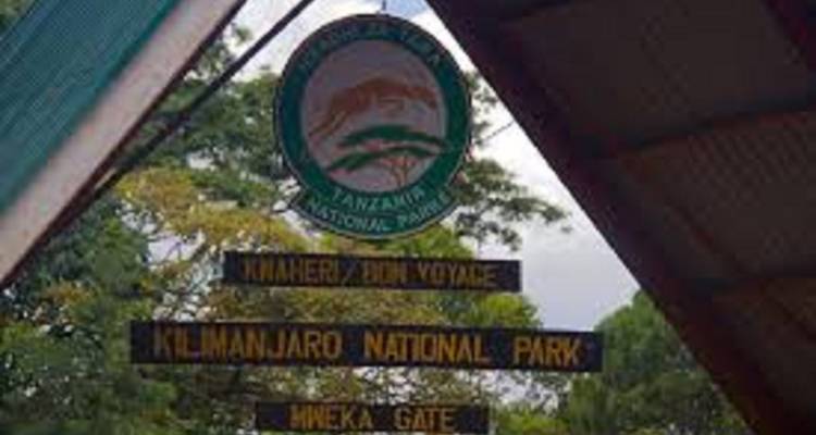 Entrance sign for Kilimanjaro National Park at Mweka Gate.