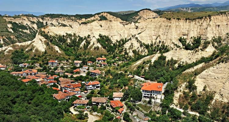 Scenic village nestled in rocky hills.