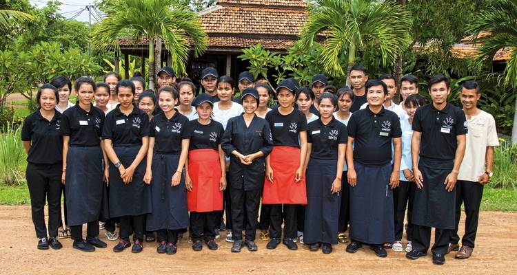 Group of people in uniform posing for a photo.