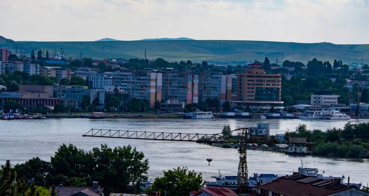 River view of a city with modern buildings.