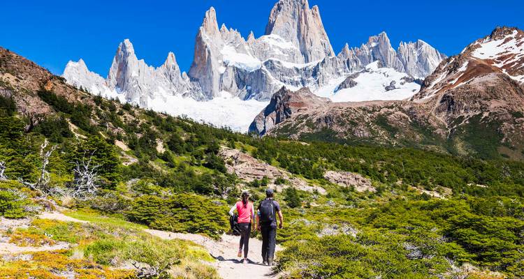 Two hikers approaching Mount Fitz Roy.