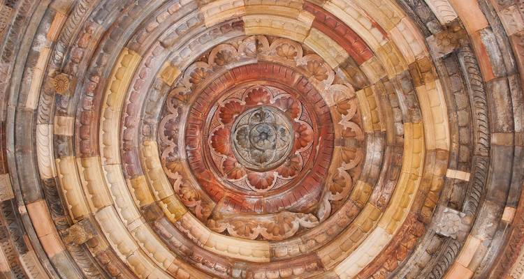 Intricately carved circular dome interior.