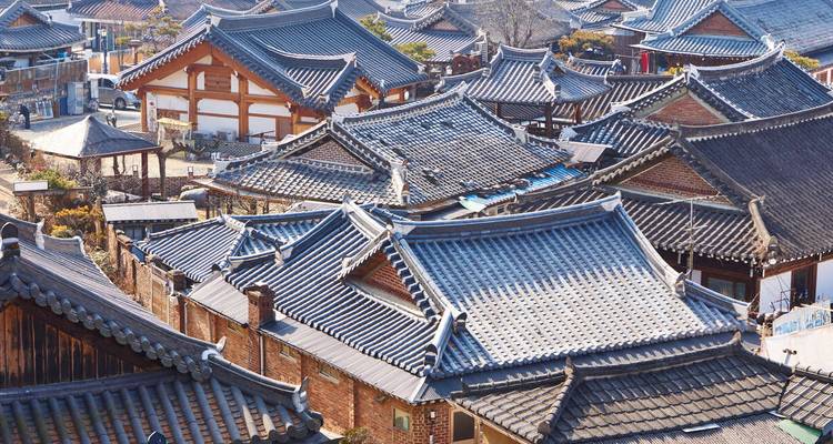 A view of traditional Korean rooftops in a historical village.