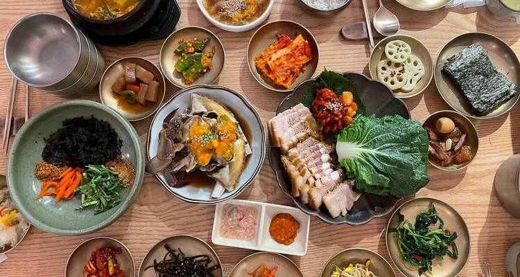 A spread of Korean dishes arranged beautifully on a table.