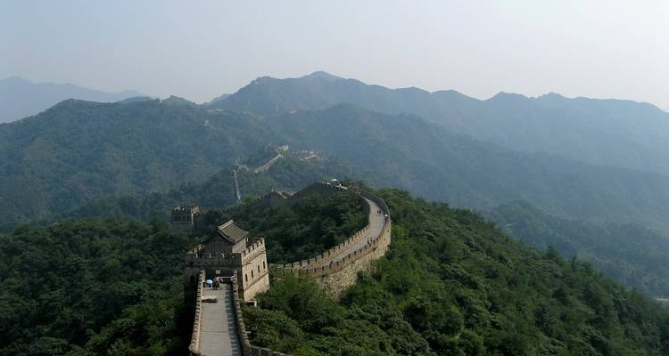 Great Wall of China stretching across mountain ridges.