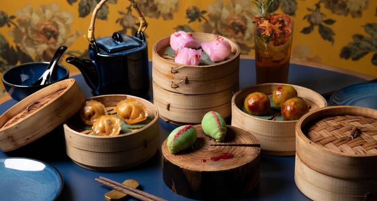 Assortment of dim sum in bamboo baskets.