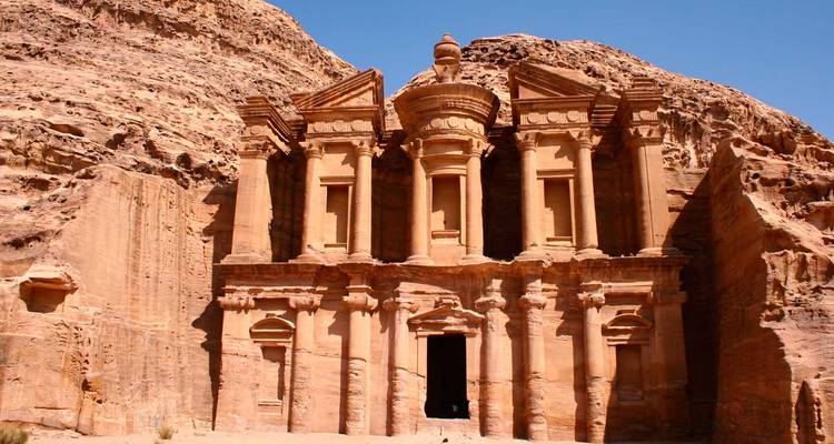 Facade of Al-Khazneh in Petra carved into sandstone.