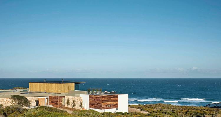 Coastal landscape view with modern structure and ocean.