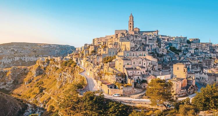 Panoramic view of a historic town on a hill with ancient buildings.
