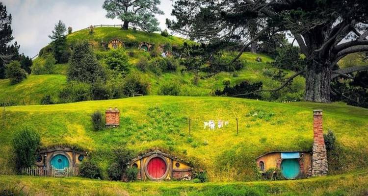Hobbit-like houses on grassy hills.