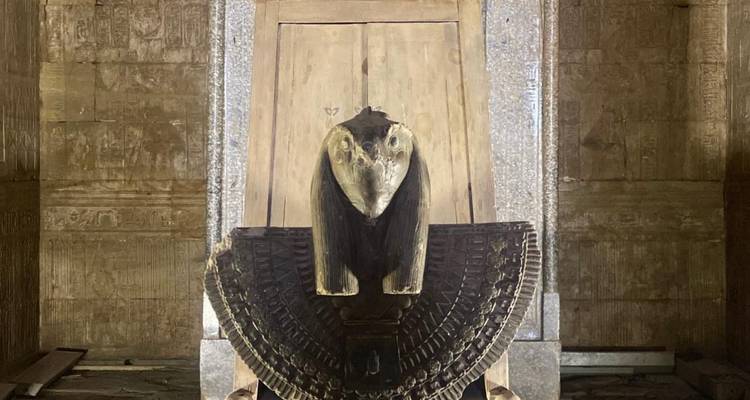 Ancient artifact with decorative carvings inside a temple.