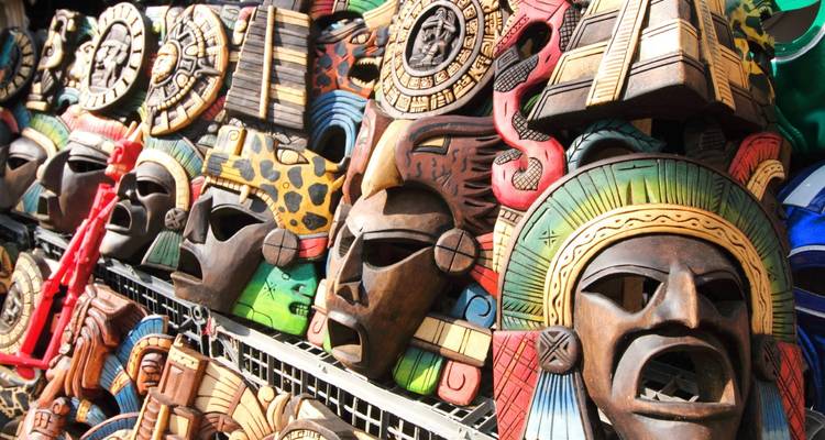 Colorful, carved wooden masks on display.