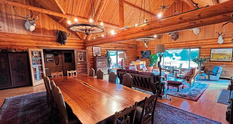 Interior of a rustic lodge with wooden furniture.