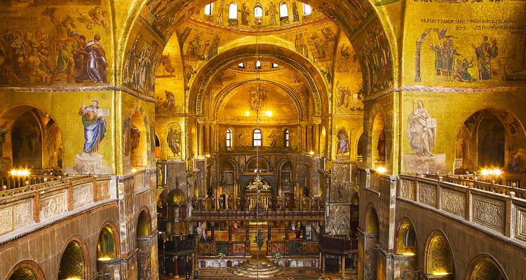 Interior of a grand basilica adorned with golden mosaics.