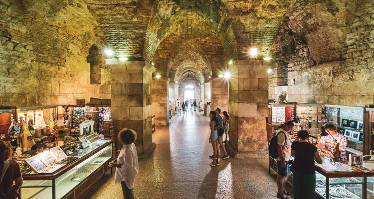 Interior market in a historic stone building.