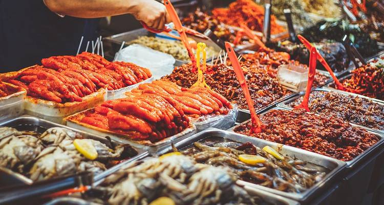 Variety of seafood and spices at a market.
