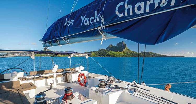 Sailboat with a view of mountains in the background.