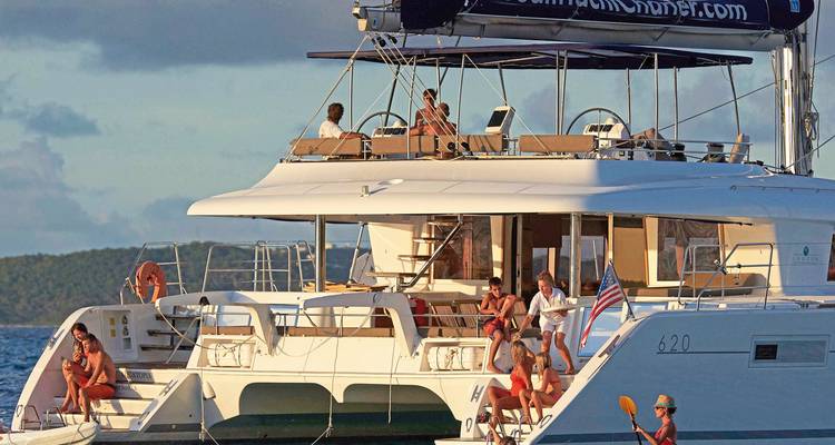 Group of people relaxing on a luxury yacht at sea.