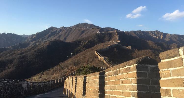 Scenic view of the Great Wall of China stretching over mountains.