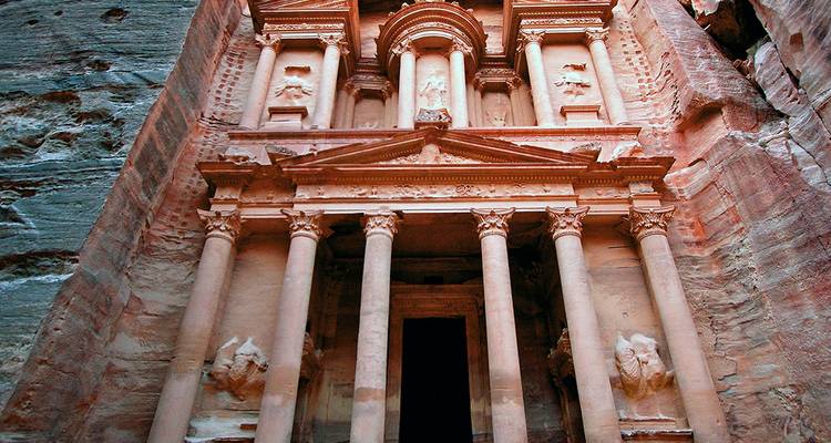 Detailed front view of the magnificent carved Treasury at Petra with warm sandstone tones.