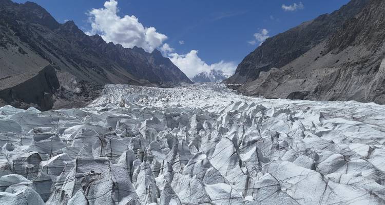 Glacier valley surrounded by rugged mountains.