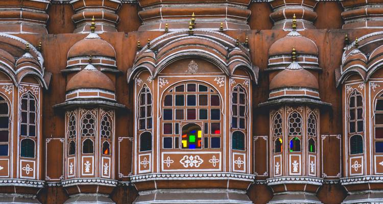 Detailed architectural windows with colored glass panels.
