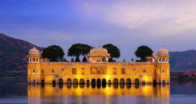 Palace is beautifully reflected on the lake at twilight.