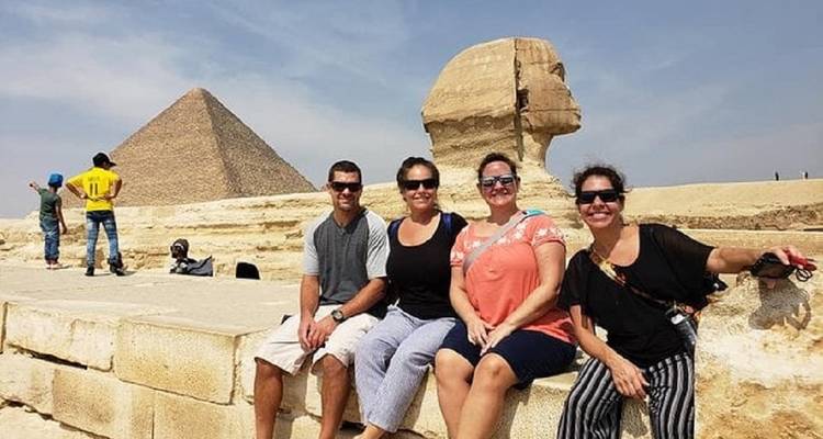 Group posing with the Sphinx and a pyramid.