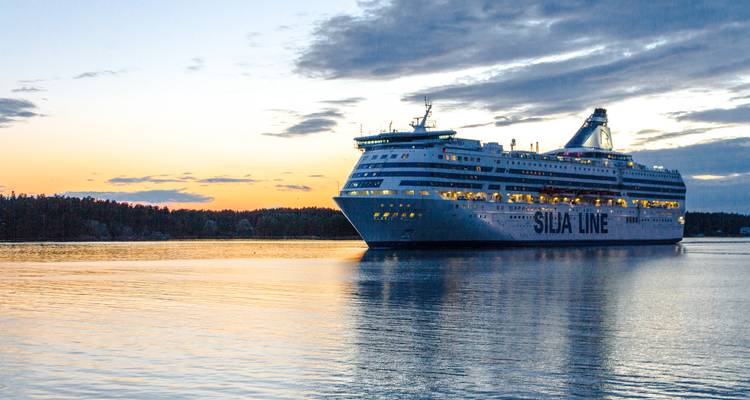 Silja Line cruise ship sailing at sunset.