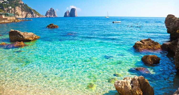 Crystal clear water with rocky coastline.